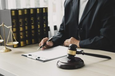 Professional woman lawyers work at a law office There are scales, Scales of justice, judges gavel, and litigation documents. Concepts of law and justice.